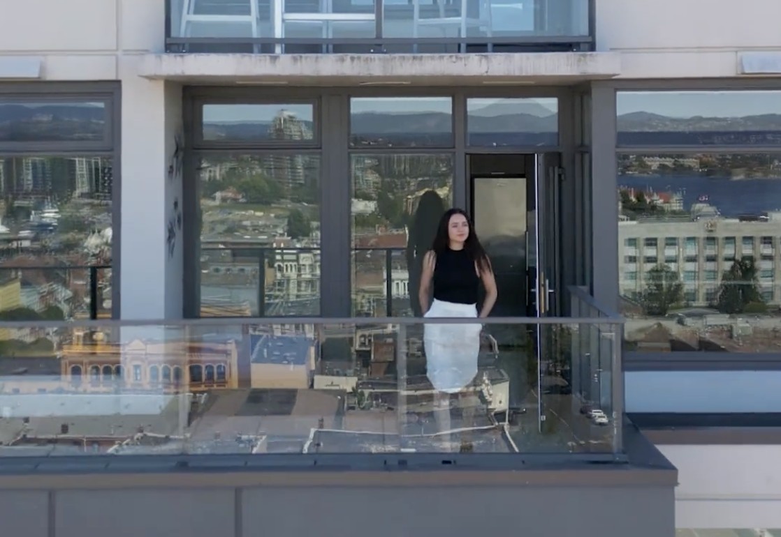 Hannah on a downtown Victoria penthouse balcony
